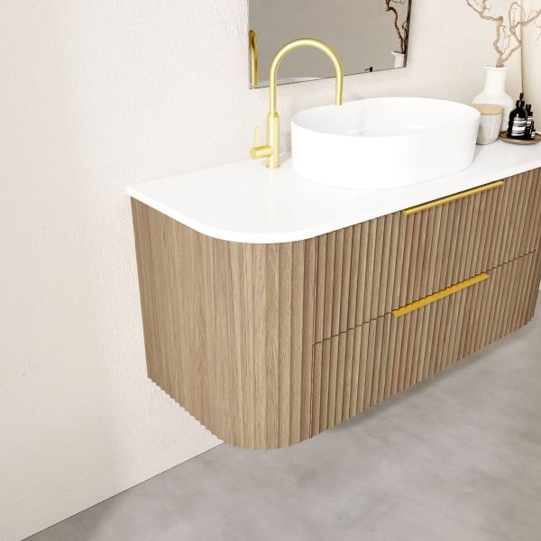 Marquis Shore wall hung vanity, woodgrain fluted drawers with white solid surface top and offset basin, angled view