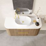 Marquis Shore wall hung vanity with white solid surface top, oval basin and fluted woodgrain drawers, front view
