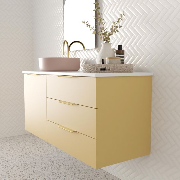 Marquis Shortland wall hung vanity with white solid surface top, pink offset basin and brass handles in yellow finish