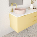 Marquis Shortland wall hung vanity with white solid surface top, pink offset basin and yellow drawer fronts