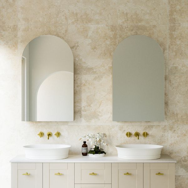 Timberline Church 600mm arched shaving cabinet in soft green, shown above a bathroom vanity with mirror doors in a lifestyle setting