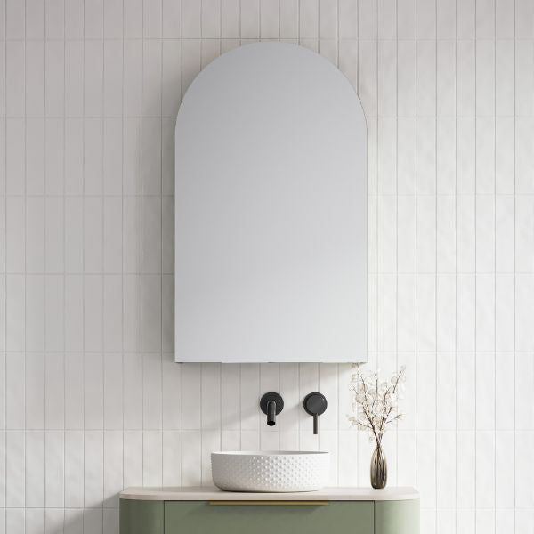 Timberline Church 600mm arched shaving cabinet in white, wall-mounted above a bathroom basin with tiled wall background
