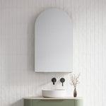 Timberline Church 600mm arched shaving cabinet in white, wall-mounted above a bathroom basin with tiled wall background