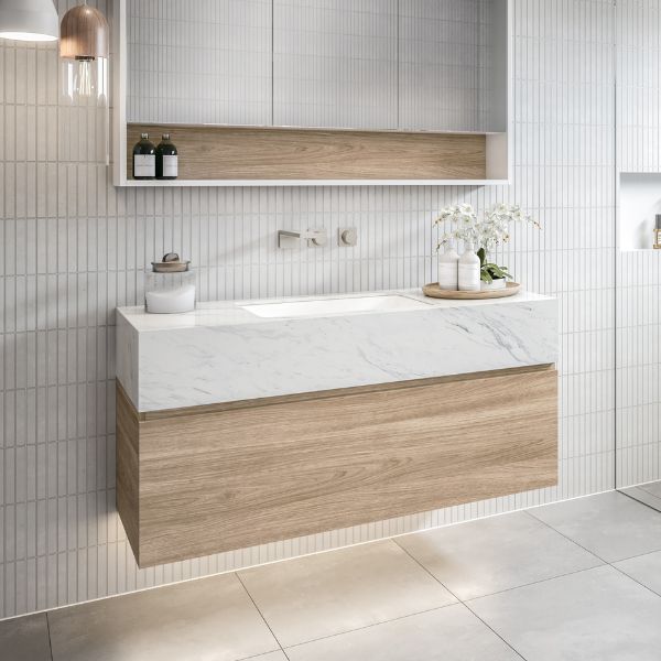 Timberline Kingsley wall hung vanity with white marble-look box top and rural oak drawer front in bathroom setting