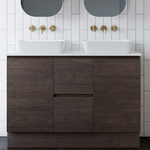 Timberline Nevada floor standing vanity in dark woodgrain finish with white stone top and above-counter basin in bathroom setting