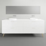 Timberline Sutherland House Regency freestanding vanity in white, with drawer fronts and tapered legs in a bathroom setting