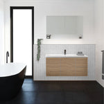 Timberline Swift wall hung vanity with white ceramic top and woodgrain cabinet in a bathroom setting