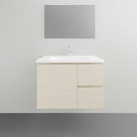 Timberline Swift wall hung vanity with white ceramic top and light woodgrain cabinet, front view in bathroom setting