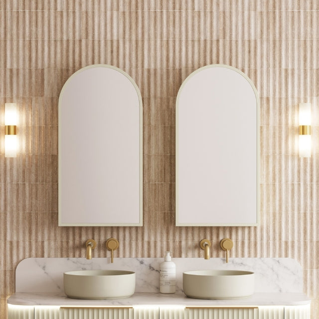 Timberline Church Frame shaving cabinet with arched mirrored doors above a double vanity, in a bathroom setting