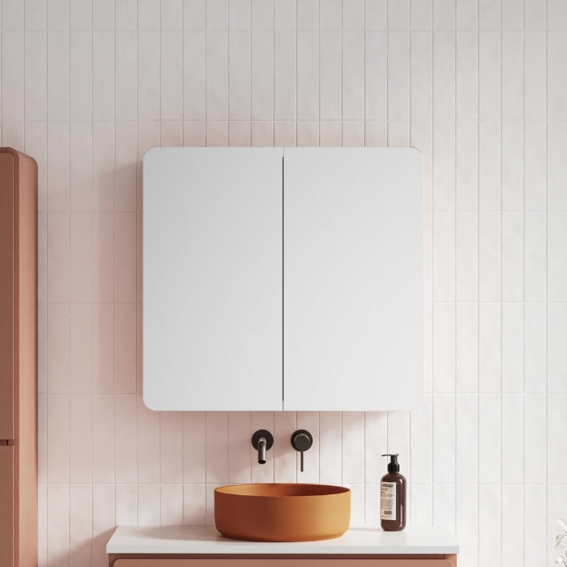 Timberline Colby shaving cabinet, white oval double-door cabinet above a basin in a bathroom setting