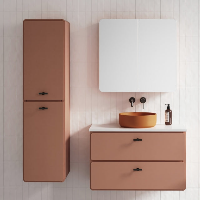 Timberline Colby wall-hung tallboy in New Penny Satin with black handles, shown beside matching vanity in bathroom setting