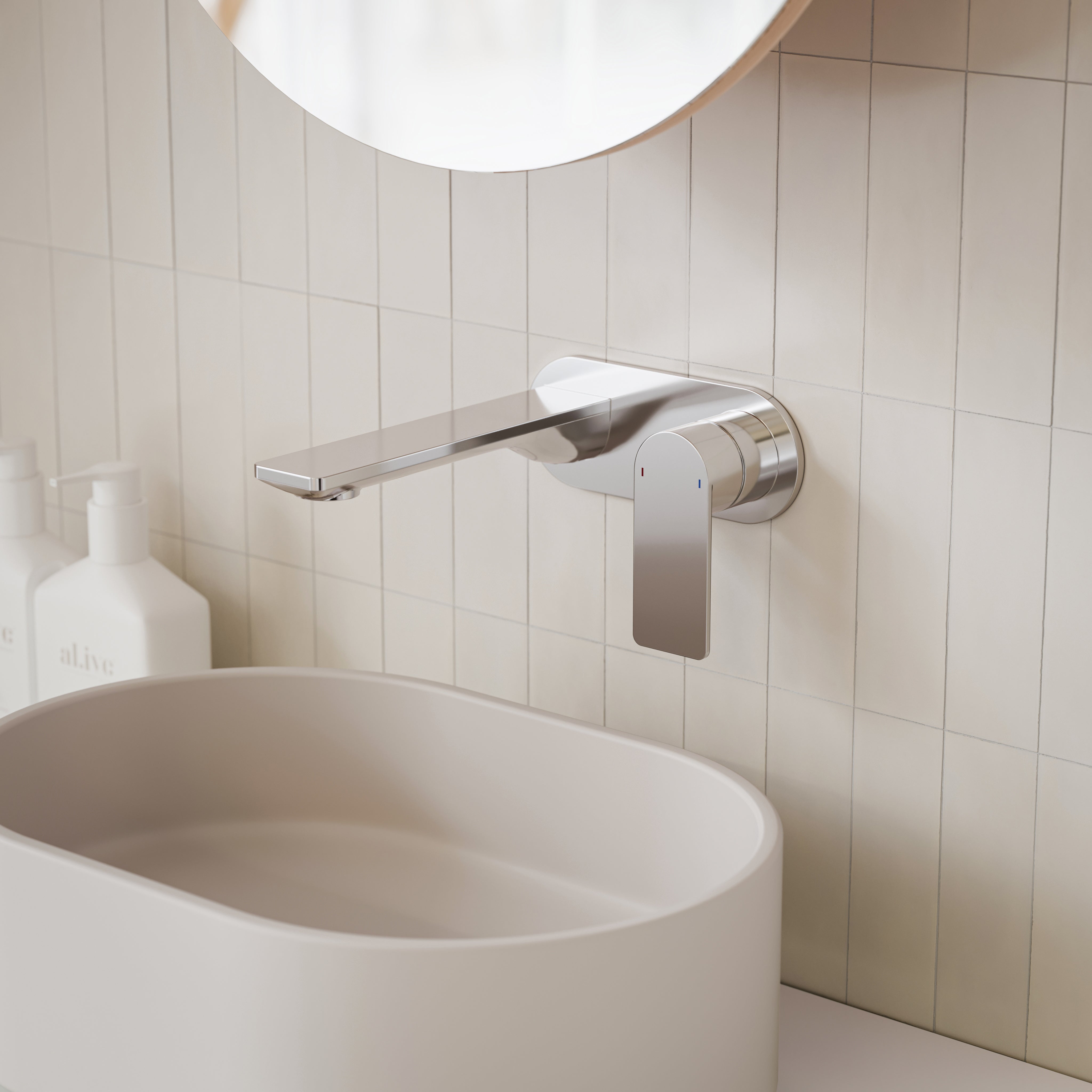 Caroma Urbane II chrome wall basin/bath mixer with round lever, shown mounted above a basin in a tiled bathroom