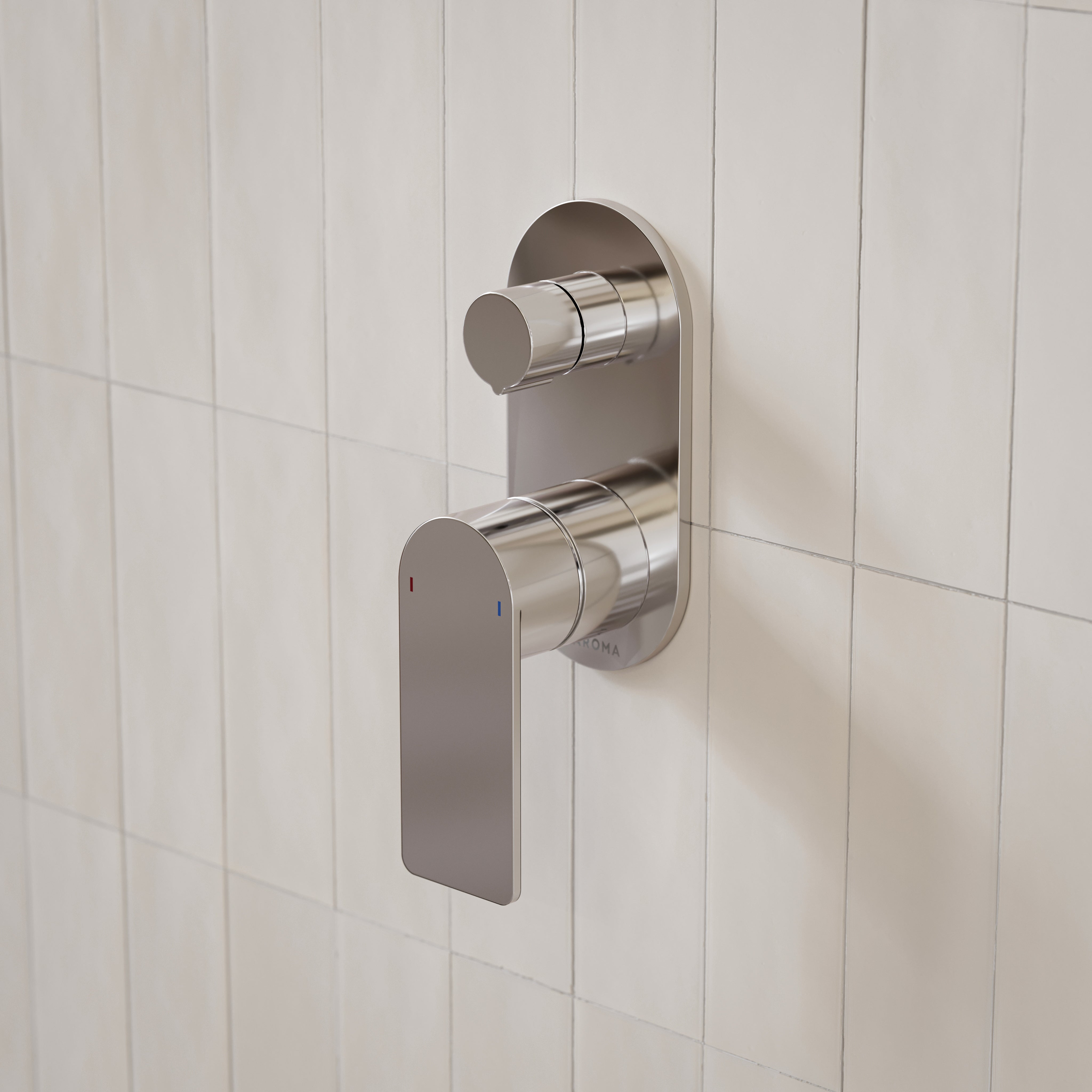 Caroma Urbane II round bath/shower mixer with diverter in polished chrome, wall mounted on white tiled bathroom wall