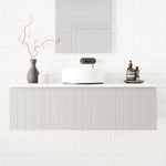 Marquis Valencia wall-hung vanity in light grey with shiplap detailing, shown with white basin in a bathroom setting