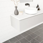 Marquis Valencia wall hung vanity in white, with offset bowl and wall-mounted design in a tiled bathroom.
