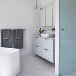 Caroma Luna gloss white above counter basin on white vanity in a modern bathroom