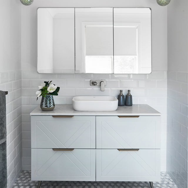 Caroma Luna above counter basin in gloss white ceramic, rectangular rounded profile, shown on a bathroom vanity with wall-mounted mixer