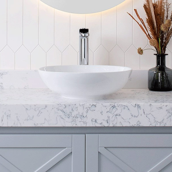 ADP Circuit round white above counter basin on a marble-look vanity in a bathroom setting