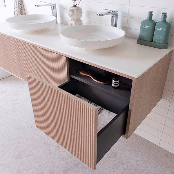 ADP Clifton wall-hung vanity with Caesarstone top, coastal oak woodgrain finish, double basin and handle-free drawers, open storage view