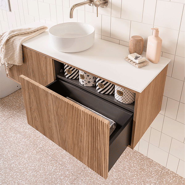 ADP Clifton wall-hung ensuite vanity with white top, prime oak woodgrain finish and round basin in bathroom scene