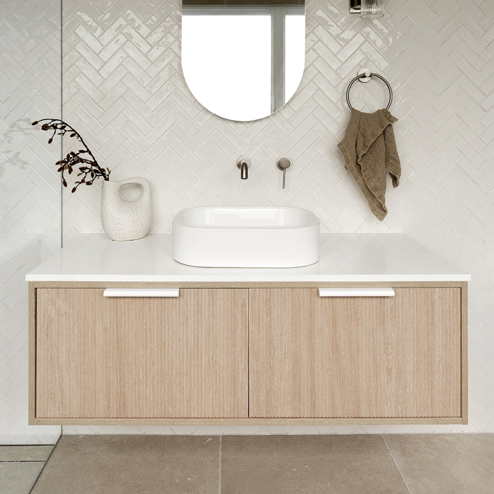 ADP Clifton wall-hung vanity with white Caesarstone top, coastal oak woodgrain finish and centre basin