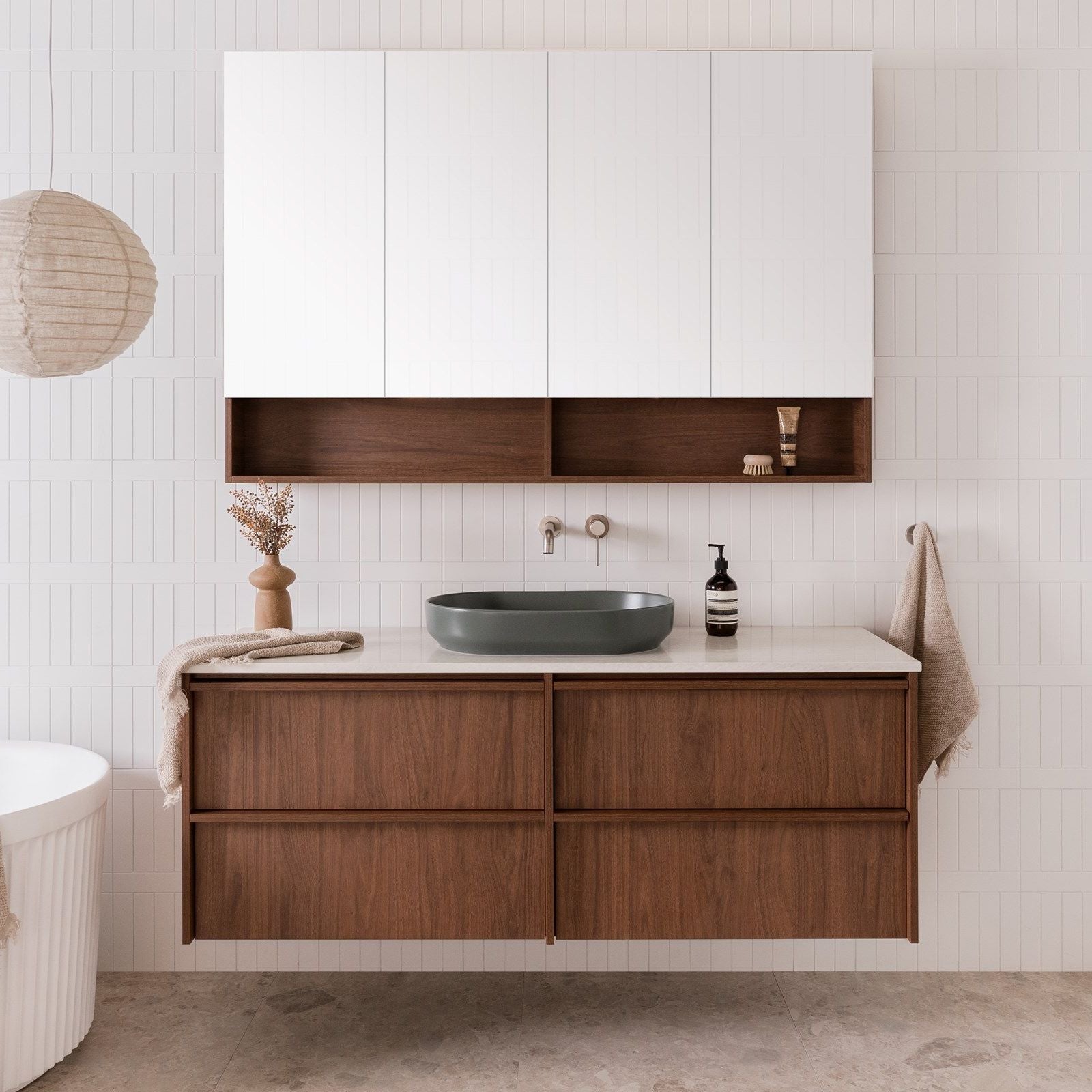 ADP Eli wall-hung vanity with white top, woodgrain drawers and open shelf, styled in a bathroom setting