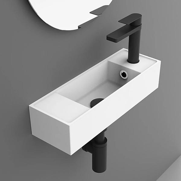 ADP Eon wall hung basin in gloss white, rectangular small hand basin with black tapware on grey wall