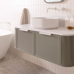 ADP 900mm vanity in muted green with rounded stone top and centre bowl, shown in a bathroom setting