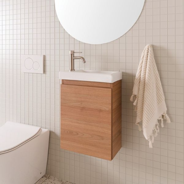 ADP Glacier Lite Mini wall hung vanity with gloss white ceramic top, Tasmanian oak woodmatt finish, in a small bathroom setting