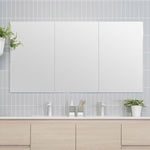 ADP Gloss Silk white rectangular shaving cabinet above vanity in bathroom setting, with three mirror doors and light grey tiled wall