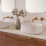 ADP Love gloss white above counter basin in a bathroom vanity setting, shown with wall tapware on a timber benchtop.