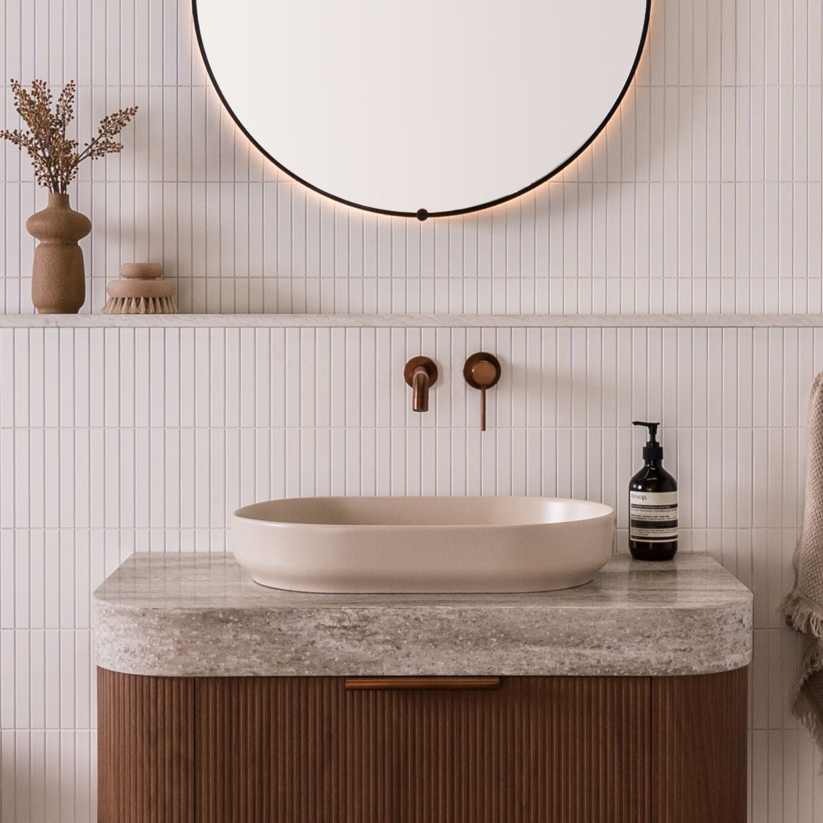 ADP Marilyn matte ivory oval above counter basin on a vanity, shown in a bathroom setting with wall-mounted tapware