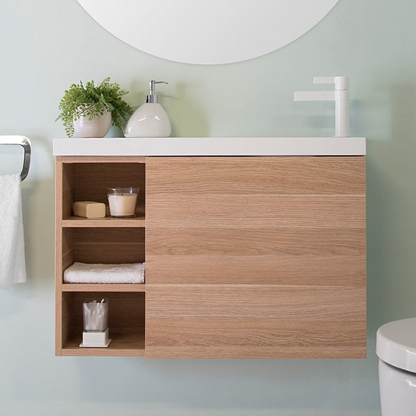 ADP Petite Shelf wall hung vanity in natural oak with white top and open left shelves in a bathroom setting