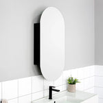 ADP Pill oval shaving cabinet in white, wall-mounted above a basin in a modern bathroom setting