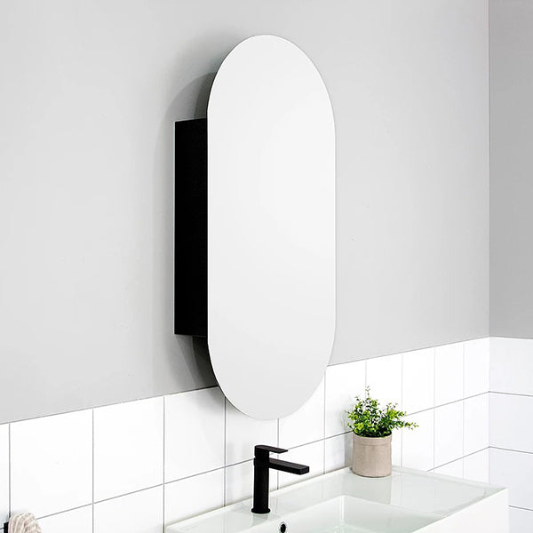 ADP Pill oval shaving cabinet in white, wall-mounted above a basin in a modern bathroom setting