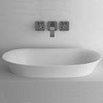 ADP Rise semi-inset basin in matte white, oval ceramic bathroom basin with wall-mounted mixer on benchtop
