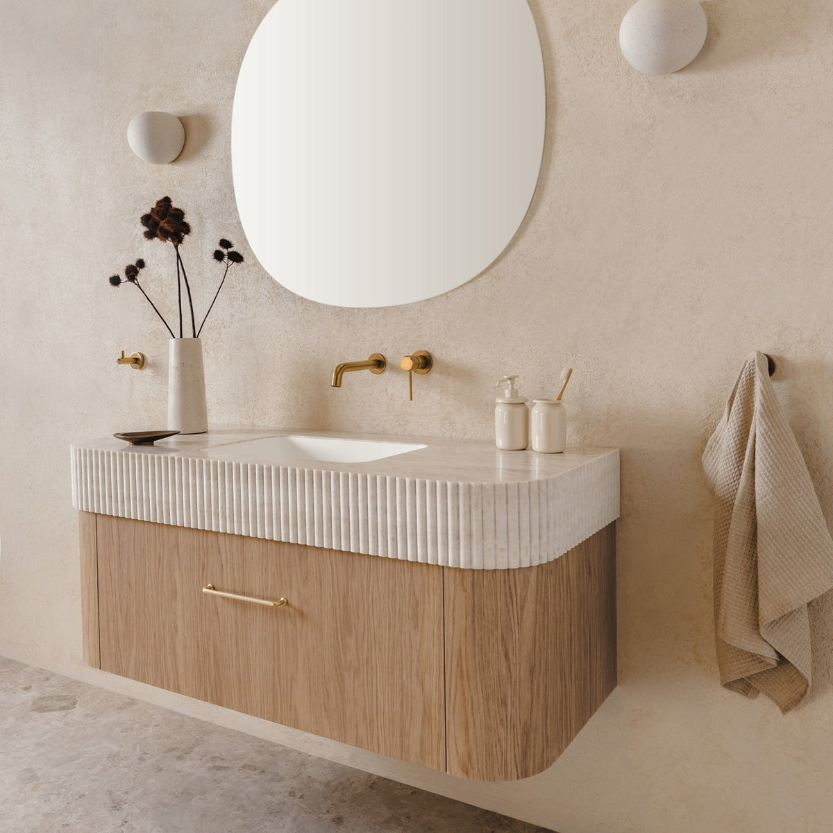 ADP Surry Imperial wall-hung vanity with fluted white top, timber-look base and centre basin in a styled bathroom
