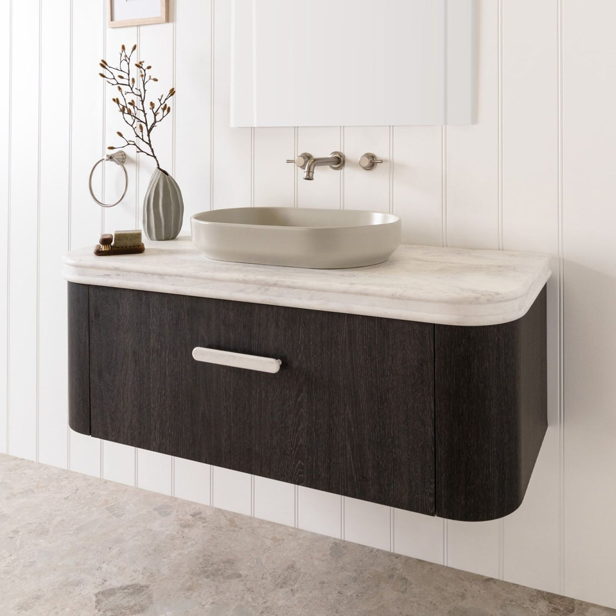 ADP Royale vanity benchtop with bullnose edge, light stone finish, shown fitted to dark timber wall-hung vanity.