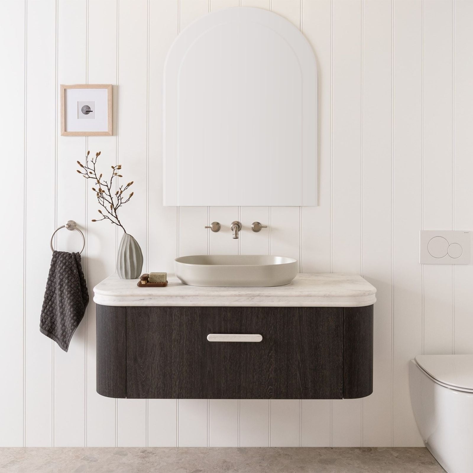 White rounded vanity benchtop with bullnose edge above dark wood ADP vanity in a bathroom setting