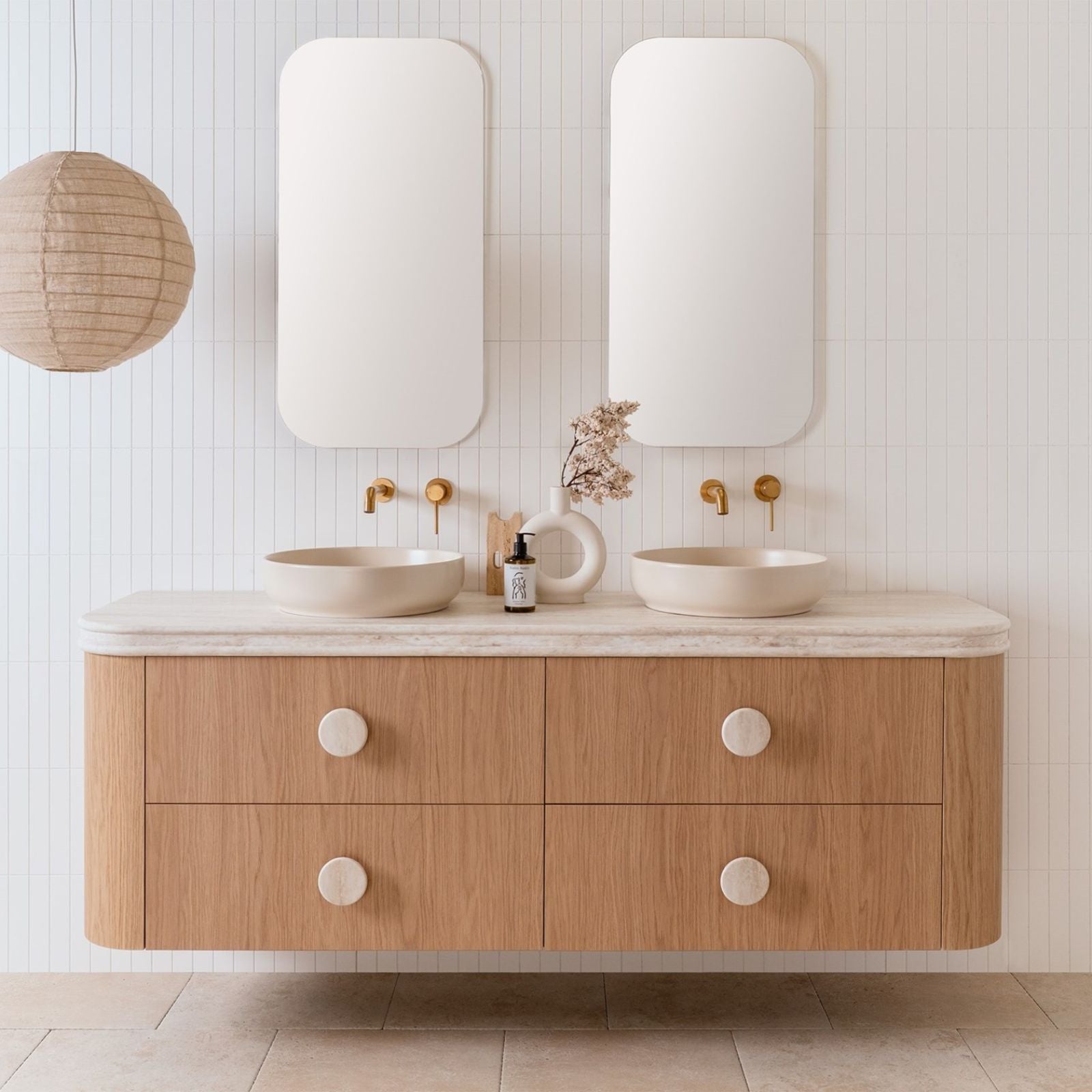 ADP Thea wall hung vanity in woodgrain oak with curved Durasein benchtop, double bowl, front view in bathroom setting