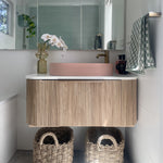 ADP Waverley wall-hung vanity in prime oak woodgrain with white top and pink basin in bathroom setting