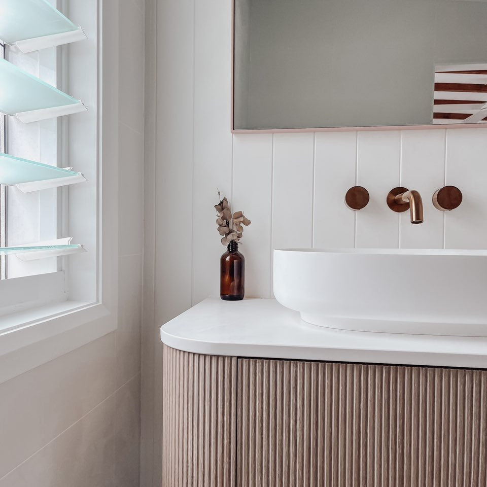 ADP Waverley wall-hung vanity with white top, Prime Oak woodmatt fluted drawers and round basin in a bathroom setting