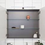 ADP Glacier Pro shaving cabinet interior with graphite finish and glass shelves, shown open in bathroom setting