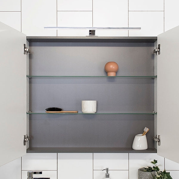 ADP Glacier Pro shaving cabinet interior with graphite finish and glass shelves, shown open in bathroom setting