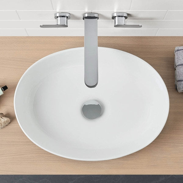 Caroma Artisan white oval above counter basin on timber vanity with chrome mixer tap, top view