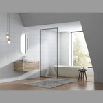 Aulic Hamilton wall hung vanity in woodgrain finish, curved ends and stone top, styled in a modern bathroom