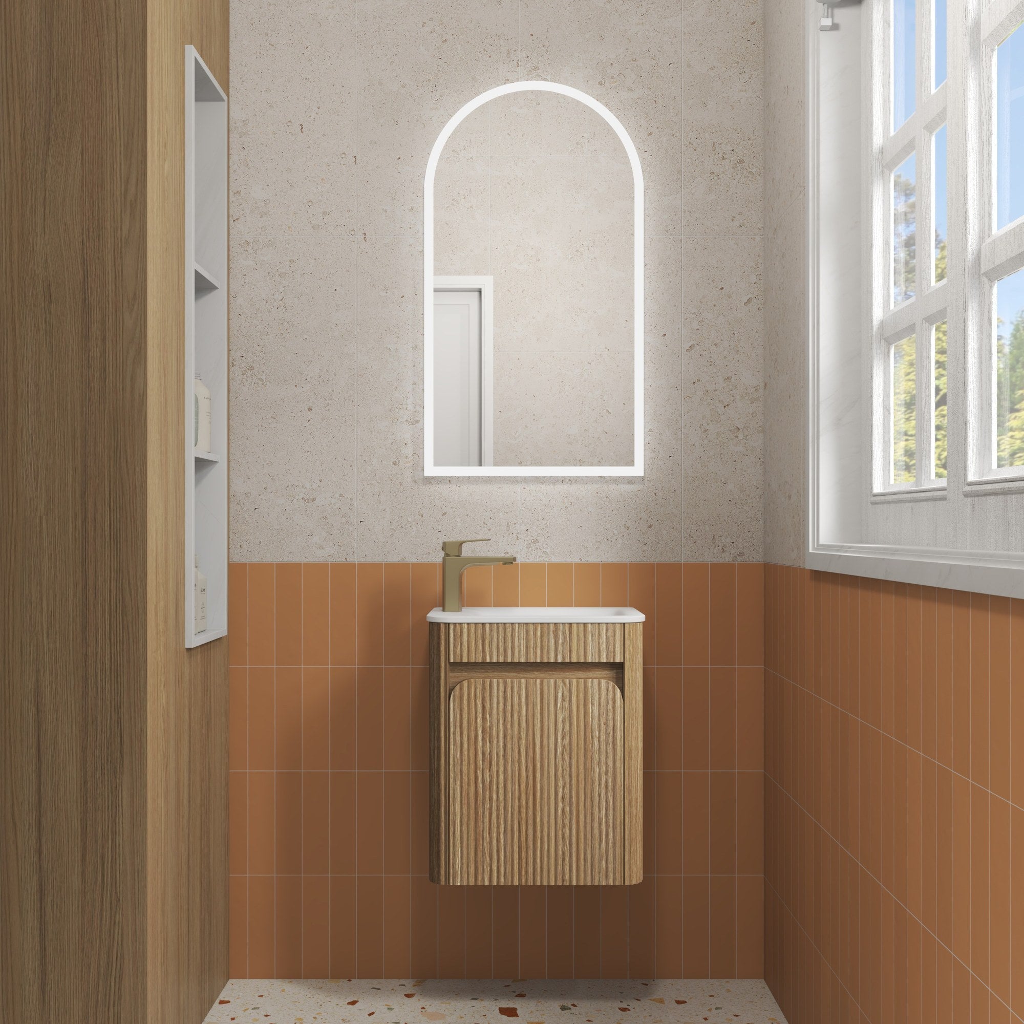Aulic Mini Hartelle wall hung vanity in Harvest Oak with white top, fluted curved front and single door in bathroom setting