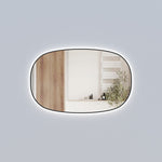 Aulic Valmont horizontal LED mirror with black frame and rounded rectangle shape, lit against a grey wall