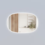 Aulic Valmont horizontal LED mirror, oval-edged with backlit glow, shown in a bathroom setting
