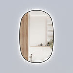 Aulic Valmont vertical LED mirror with black frame, tall rounded rectangle design and soft backlit glow